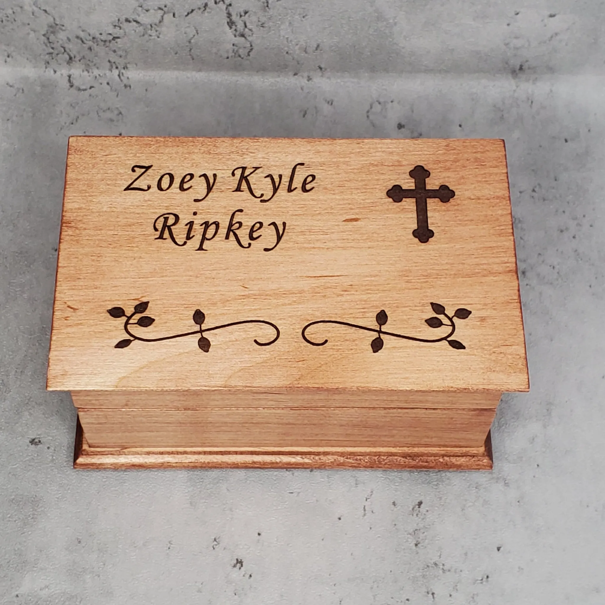 Christening box with name and cross on top with built in music player